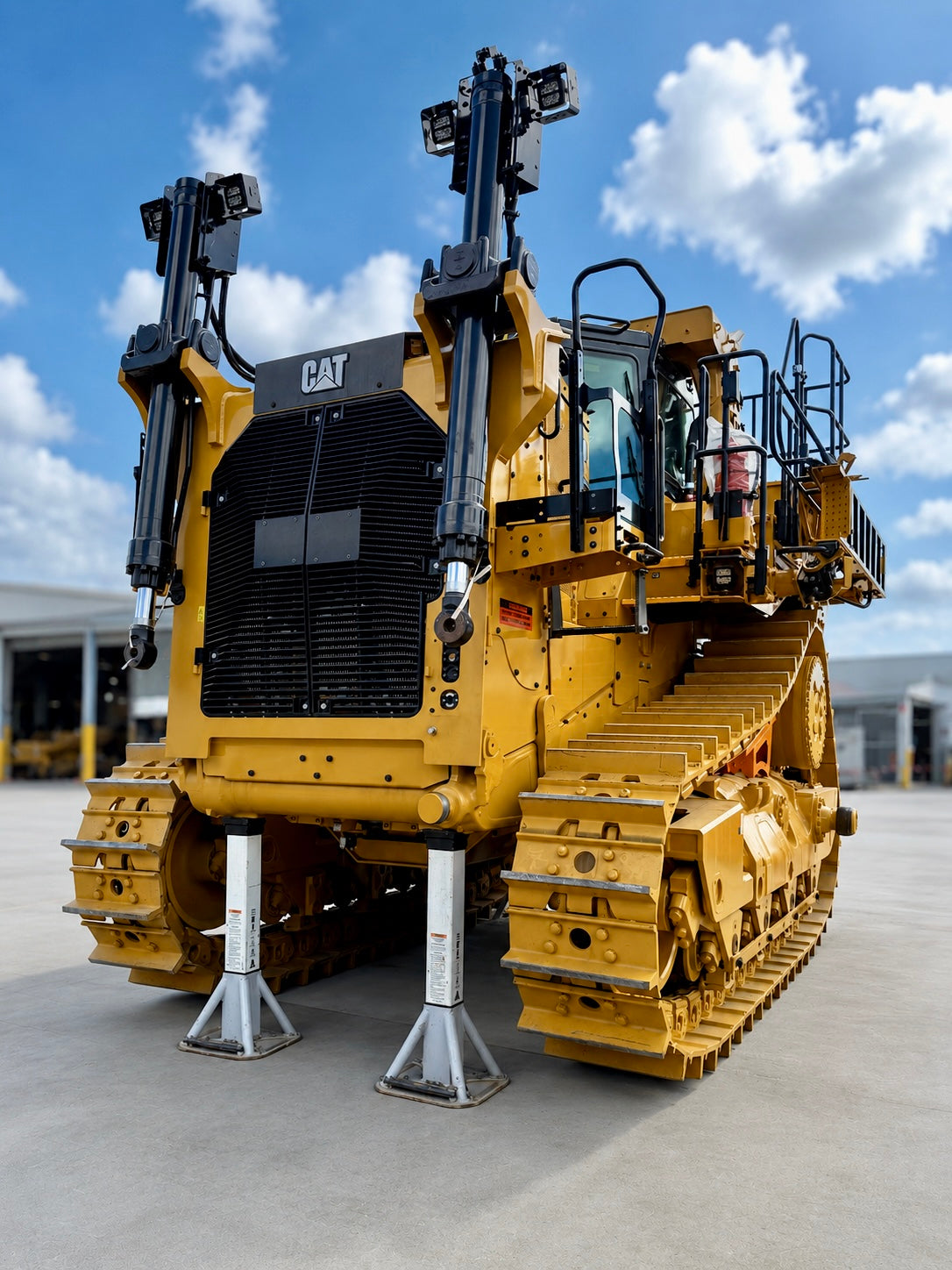 Caterpillar dozer supported by 50t Composite Support Stands during workshop maintenance