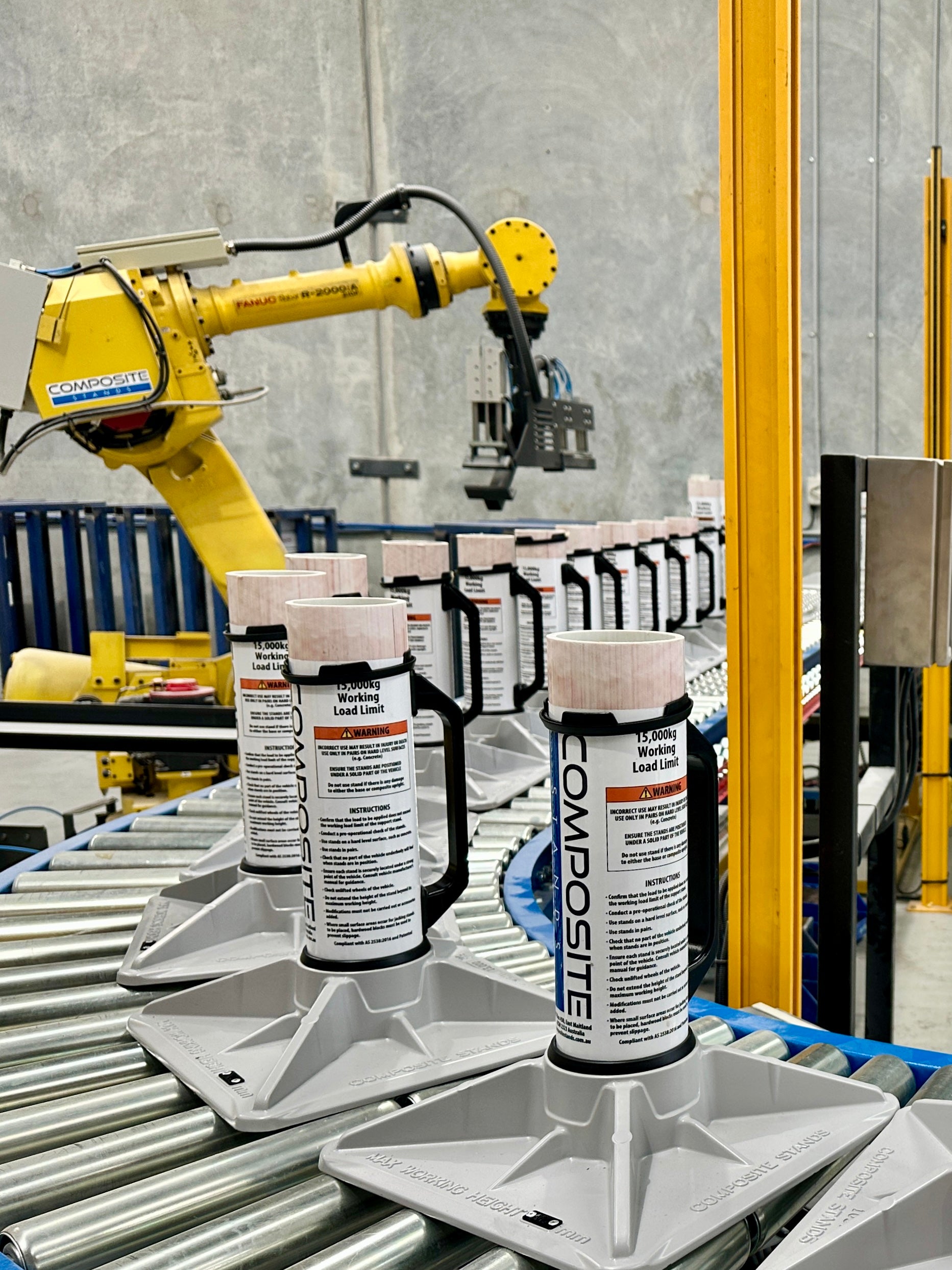 Composite Stands moving through an automated production line on a conveyor

